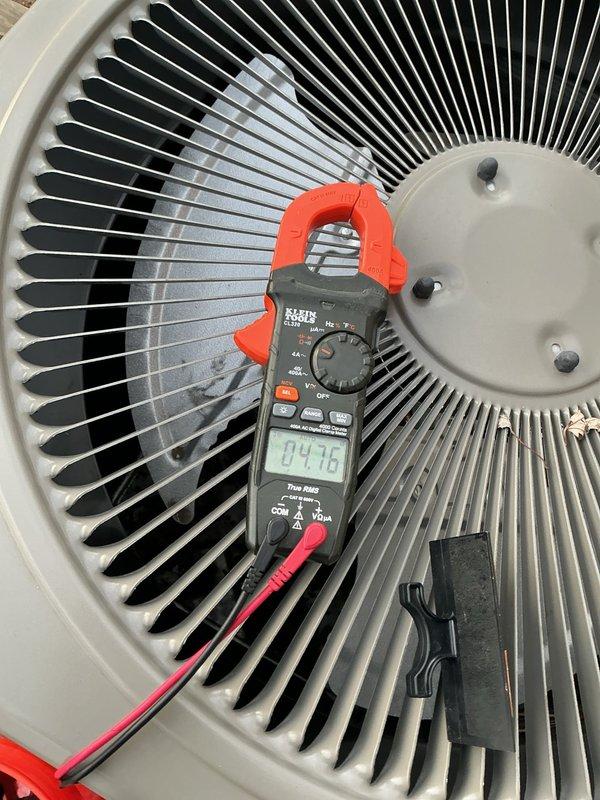 Performed comprehensive air conditioning maintenance tune-up on outdoor condensing unit. Verified proper amperage draw at 4.48 amps using digital clamp meter, indicating normal compressor operation. Inspected condenser coil fins, fan motor assembly, and refrigerant line connections; all components found in good working condition with no heating or furnace concerns reported.