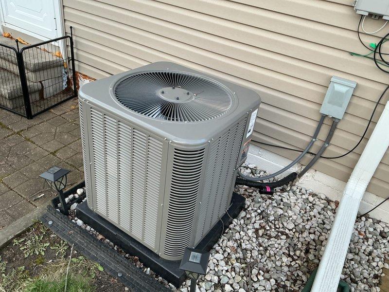 Performed comprehensive air conditioning maintenance tune-up on outdoor condensing unit. Verified proper amperage draw at 4.48 amps using digital clamp meter, indicating normal compressor operation. Inspected condenser coil fins, fan motor assembly, and refrigerant line connections; all components found in good working condition with no heating or furnace concerns reported.