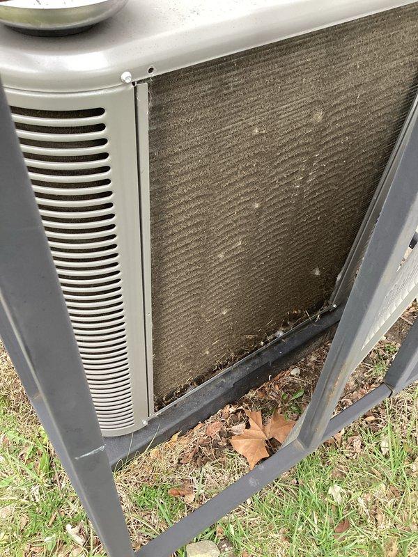 Completed scheduled Air Care Cooling maintenance on outdoor condensing unit. Upon arrival, found extensive dirt and debris accumulation on condenser coils and significant organic matter buildup at unit base. Performed thorough coil cleaning to restore proper heat transfer efficiency, removed leaves and debris from unit perimeter and base, and verified all components operational following maintenance procedures.