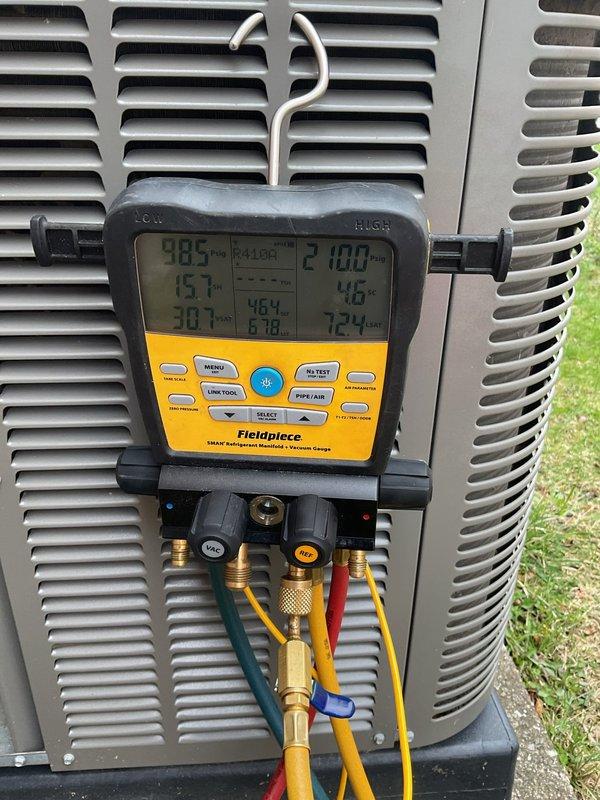 Completed Air Care Cooling recurring maintenance service on outdoor condensing unit. Upon arrival, found condenser coils heavily soiled with dirt, dust, and debris buildup requiring attention. Performed system diagnostics using manifold gauges to verify operating pressures and temperatures. Installed new air filter as requested. Documented equipment condition with photos showing significant exterior contamination on coil surfaces that may impact heat transfer efficiency if not addressed during future maintenance visits.