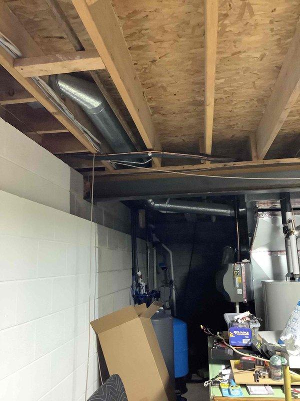 Conducted on-site assessment for new Generac generator installation at residential property. Evaluated existing electrical infrastructure, including main service panel location in basement and available space for generator placement. Documented current electrical system configuration, mechanical room layout, and utility connections to determine optimal generator sizing and installation requirements. Photographed electrical panel, HVAC equipment, water heater, and basement utility area to assess clearances, ventilation needs, and transfer switch mounting location. Identified 30-year-old home with standard residential electrical service requiring integration of automatic transfer switch with existing distribution panel. Reviewed available pathways for gas line connection, electrical conduit routing, and exterior generator pad placement to prepare comprehensive installation estimate.