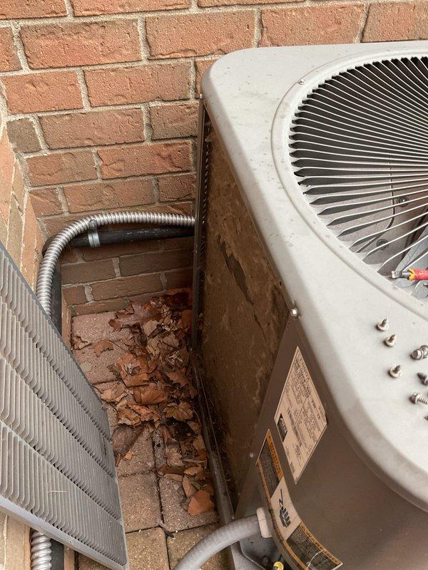 Completed annual cooling maintenance on outdoor HVAC system. Cleared debris and accumulated leaves from around both units, inspected refrigerant lines and electrical conduit connections, and replaced air filters and evaporative cooler pads as requested. System tested and operating within normal parameters.