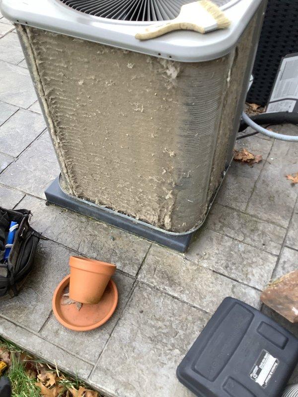 Completed routine air conditioning maintenance visit on residential condenser unit. Upon arrival, found exterior coils heavily contaminated with dirt, dust, and debris buildup that was significantly restricting airflow and reducing system efficiency. Performed thorough coil cleaning to remove compacted material from aluminum fins and exterior surfaces. Inspected fan assembly and mechanical components for proper operation. Restored unit to optimal operating condition with improved airflow through condenser coils.