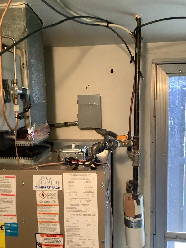 Responded to callback for HVAC installation to address improperly secured unit disconnect. The disconnect box mounting hardware was oversized for the wall connector opening, creating a gap that compromised secure attachment to the structure. Corrected the installation by properly securing the disconnect cover to the wall connector using appropriately sized mounting hardware, ensuring code-compliant electrical safety and stable equipment mounting.
