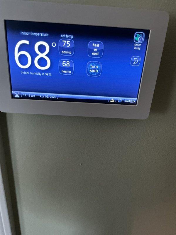 Completed scheduled air conditioning maintenance on Carrier system. Verified thermostat operation showing 68°F indoor temperature with 39% humidity and proper communication with HVAC unit. Inspected internal mechanical components, blower assembly, and refrigerant connections for proper operation and wear patterns.