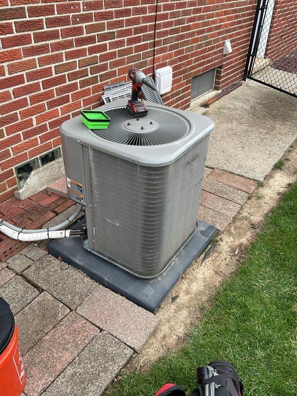 Completed annual preventative maintenance on residential split system air conditioning unit. Performed comprehensive inspection of outdoor condensing unit including cleaning of condenser coils, verification of refrigerant levels, electrical connection testing, and operational assessment of compressor and condenser fan motor. All components found to be functioning within normal parameters with no deficiencies noted.