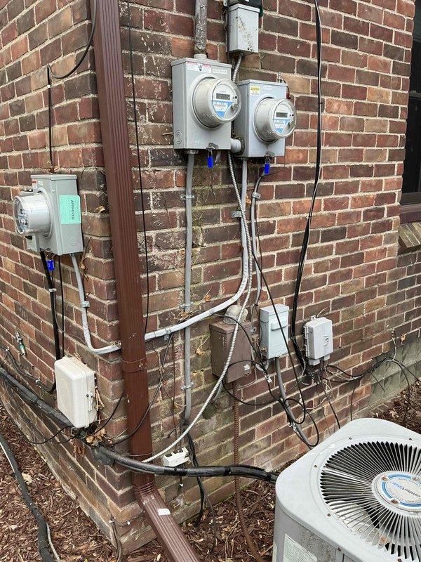 Completed sales estimate for new Mitsubishi mini split system installation to replace existing R22 air handler system. Assessment included evaluation of current electrical service capacity at exterior meter location and inspection of existing basement ductwork requiring replacement. Documented existing utility connections, HVAC equipment placement area, and basement plumbing infrastructure to determine optimal routing for new refrigerant lines and condensate drainage.