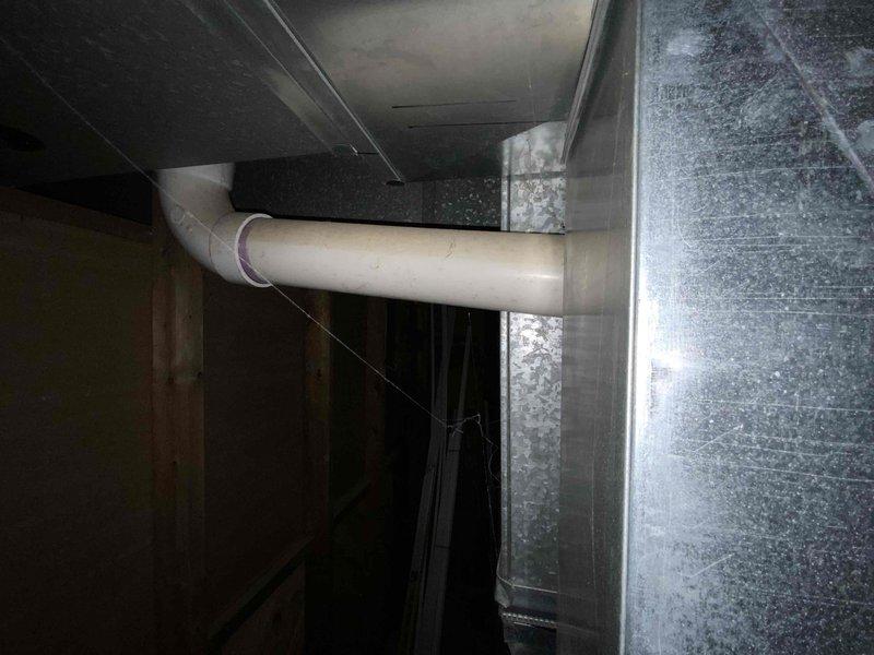 Conducted estimate for replacement of 25-year-old electric furnace and air conditioning system located in basement. Current equipment is operational but nearing end of service life with visible dust accumulation on ductwork and aging sheet metal components. Evaluated existing PVC drainage lines, ductwork configuration, and equipment accessibility in unfinished mechanical space to provide comprehensive replacement options for both heating and cooling units.
