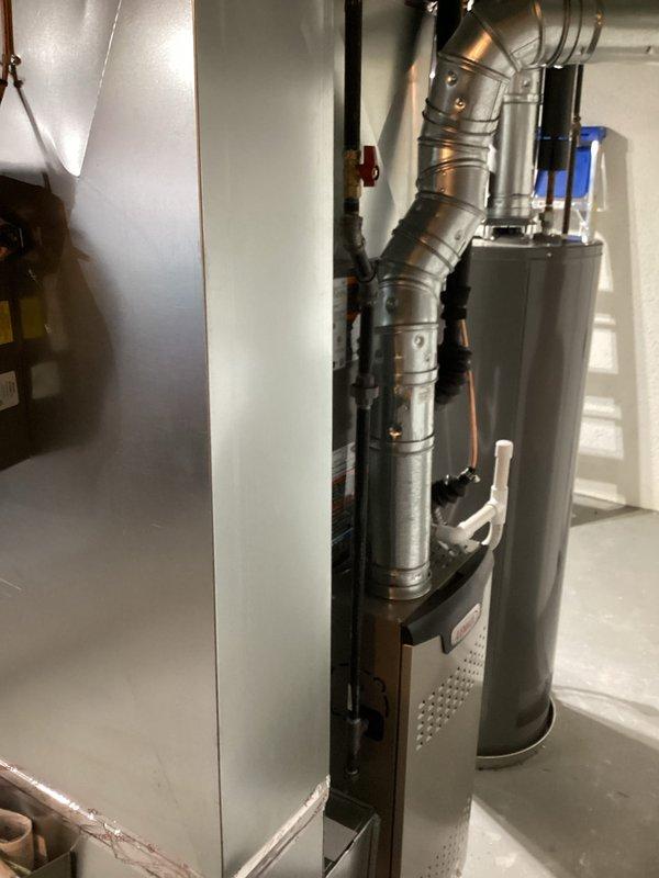 Completed full HVAC system installation including a 70,000 BTU furnace (model EL280UH076E36AK-01) and 2.5-ton air conditioning unit positioned on the right side of the property. Installation included humidifier integration and reconnection of existing ductwork and utilities. All mechanical and electrical permits were obtained prior to installation, and system was tested and verified operational upon completion.