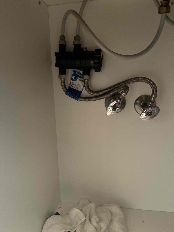 Responded to warranty recall for noise complaint on recently installed tankless water heater. Diagnosed plunking noise originating from unit as faulty flow sensor assembly. Replaced defective flow sensor component under parts and labor warranty, resolving the issue.