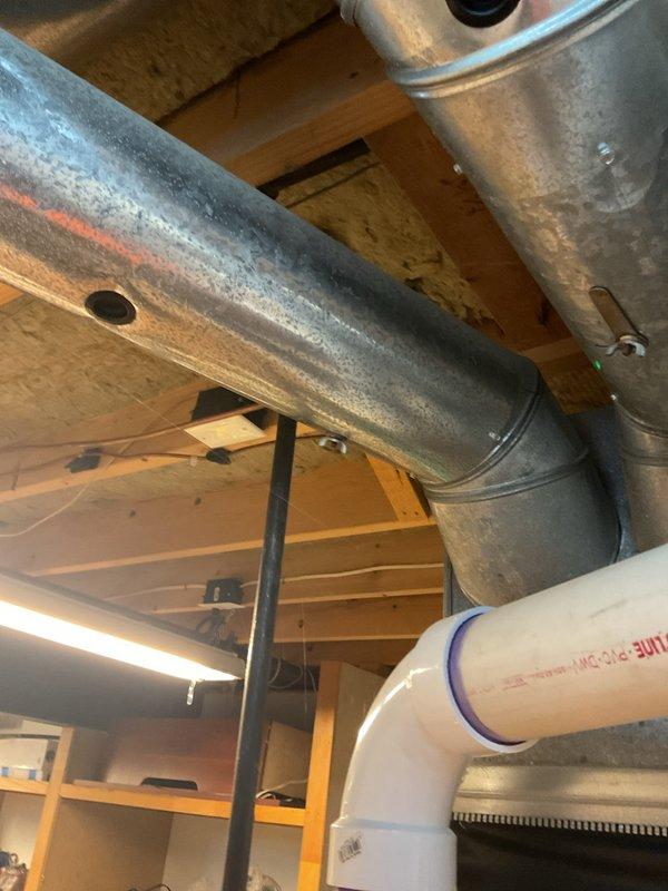 Responded to service call for loud noises coming from blower fan on 7+ year old furnace located in basement. Upon inspection, diagnosed blower motor bearing failure causing excessive noise during operation. Replaced defective blower motor assembly and verified proper airflow and quiet operation. Inspected ductwork and noted condensation present on supply ducts, which is unrelated to the blower issue but indicates potential insulation needs. System tested through multiple heating cycles with no abnormal sounds detected. Unit operating within manufacturer specifications with parts covered under warranty.