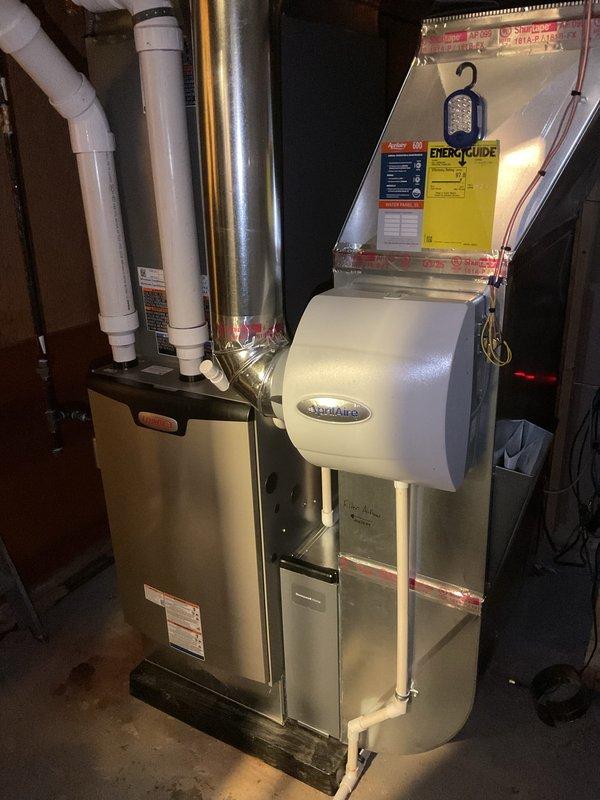 Completed full HVAC system installation including two 110,000 BTU furnaces with AprilAire humidifiers, one 5-ton air conditioning unit, one 4-ton air conditioning unit with rear discharge configuration, and one hot water heater with liner. Performed all mechanical, electrical, and plumbing connections required for system operation, installed proper ductwork and venting, and completed electrical reconnection for all equipment to ensure full system functionality.