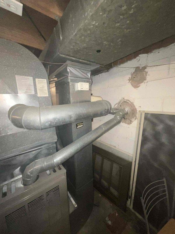 Conducted estimate for replacement of natural gas furnace and air conditioning system located in basement. Current air conditioning unit is non-operational. Evaluated existing HVAC infrastructure including furnace, ductwork, and plenum configuration. Documented equipment condition and installation requirements through photographs of mechanical room setup.