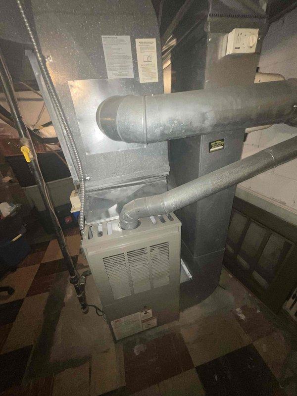 Conducted estimate for replacement of natural gas furnace and air conditioning system located in basement. Current air conditioning unit is non-operational. Evaluated existing HVAC infrastructure including furnace, ductwork, and plenum configuration. Documented equipment condition and installation requirements through photographs of mechanical room setup.
