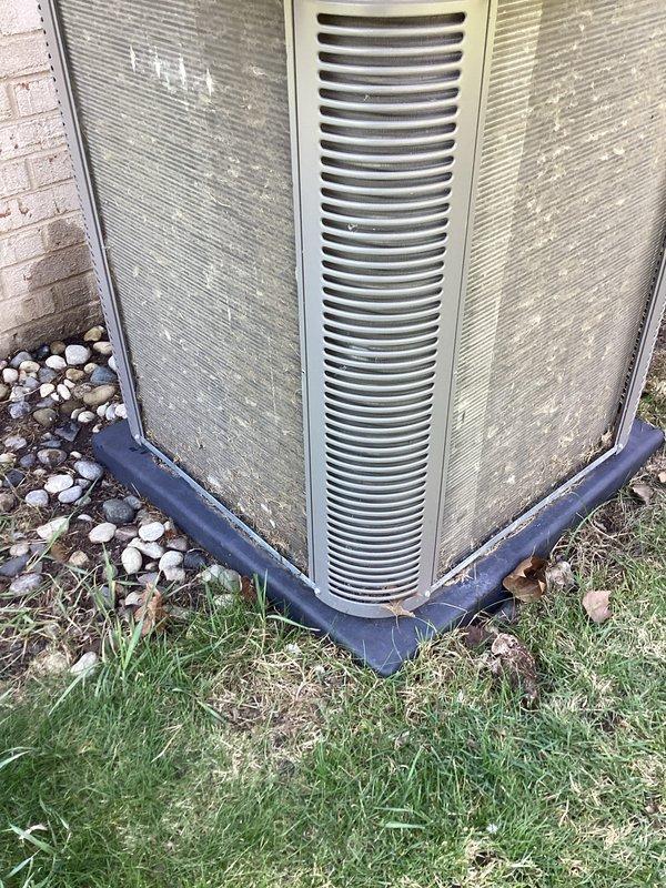 Completed annual cooling maintenance on residential outdoor condenser unit. Performed standard ACM protocol including inspection of exterior housing, louvers, and grilles, verification of proper airflow through horizontal fin assembly, and documentation of unit condition. Unit operational with normal weathering present on exterior panels; noted significant water pooling and drainage issues around concrete pad requiring customer attention to prevent future equipment concerns.