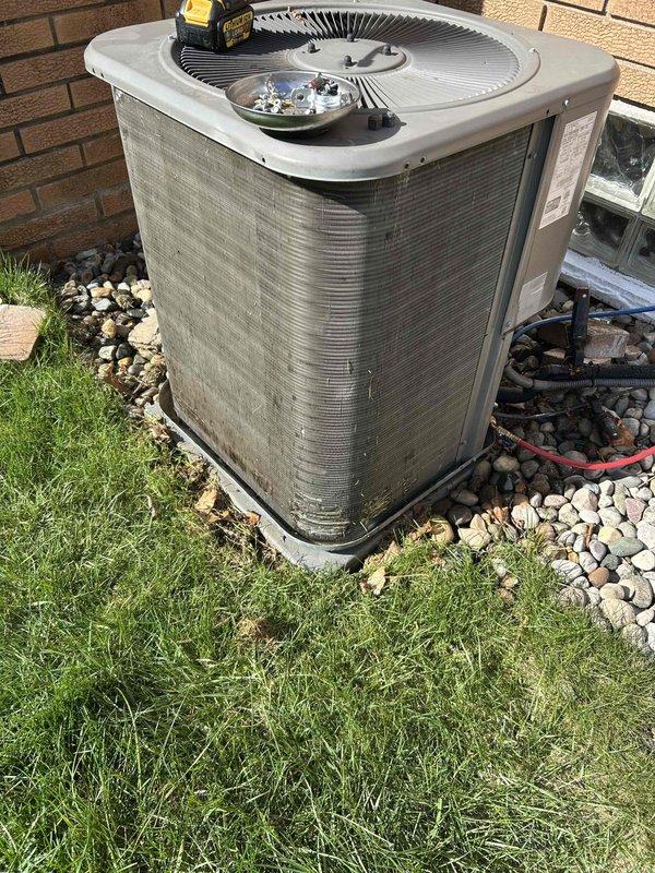 Completed annual cooling maintenance on residential air conditioning system. Performed comprehensive inspection of outdoor condenser unit, checked refrigerant levels, cleaned coils, tested electrical components with multimeter, and verified proper system operation. Unit found to be operating within normal parameters with no issues identified.