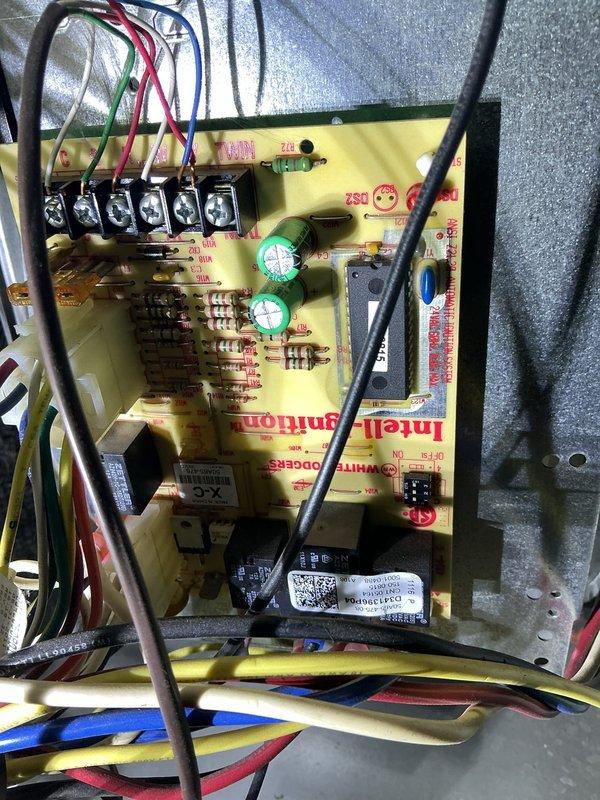 Responded to no heat call on 11-year-old furnace in basement blowing cold air only. Upon inspection, diagnosed failed control board with visible component damage affecting heating operation. Accessed control board assembly, disconnected power and wiring connections, removed failed board from metal enclosure, and installed replacement control board. Reconnected all low-voltage and line-voltage wiring to proper terminals, verified secure connections at terminal blocks, and restored power to unit. Tested system operation through complete heating cycle, confirmed ignition sequence, burner operation, and proper heat output. Unit now heating normally with all safety controls functioning as designed.
