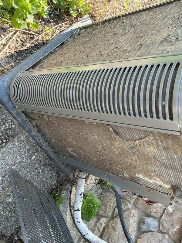 Completed routine maintenance on an 8-year-old central air conditioning system currently operating properly. Performed comprehensive AC tune-up including inspection of outdoor condensing unit, verified proper airflow through condenser coils, checked refrigerant levels, and tested electrical connections. Noted moderate accumulation of dirt and debris on condenser fins and surrounding area; cleaned coils to restore optimal heat transfer efficiency. Inspected condensate drainage system including PVC discharge lines for proper operation. All components tested within normal operating parameters, and system left in good working condition for continued reliable cooling performance.