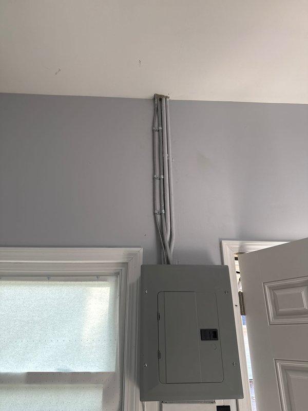 Completed full HVAC system installation including a 70,000 BTU furnace and 2-ton air conditioning unit with rear discharge configuration. Installed new electrical circuit with conduit routing to support system requirements. Connected all supply and return ductwork, gas lines, condensate drainage, and refrigerant lines. Mounted furnace on platform base and secured all mechanical, electrical, and ventilation components per code requirements.