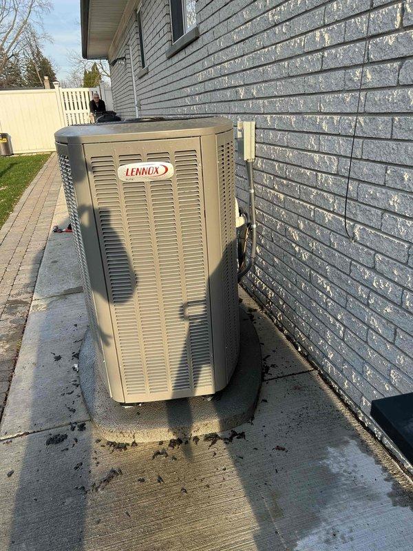 Completed one-year complimentary maintenance inspection on Lennox air conditioning system. Performed comprehensive AC tune-up on less than one-year-old unit, including inspection of outdoor condensing unit, verification of proper system operation, and documentation of equipment condition. Unit found operating properly with no deficiencies noted; exterior surfaces showed normal environmental exposure and debris accumulation on protective grilles.