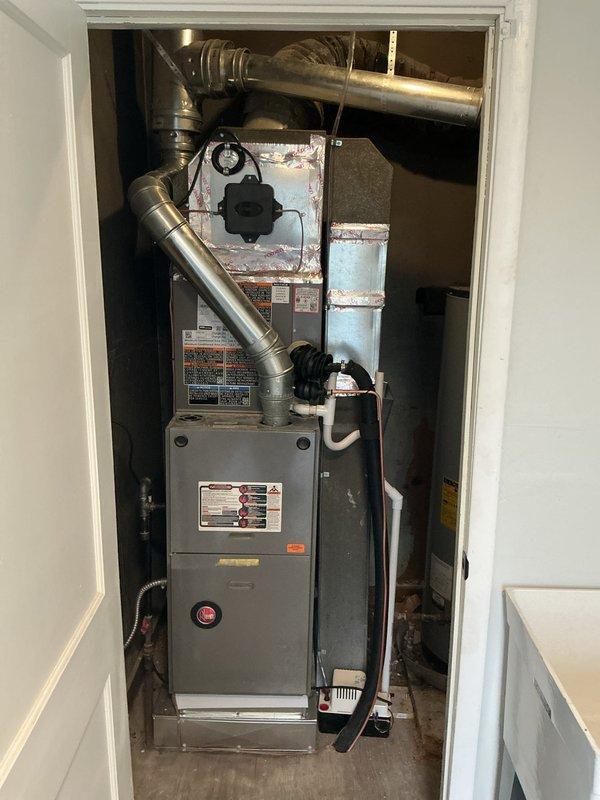 Completed installation of 2-ton air conditioning system with evaporator coil in residential utility closet. Installed new air handler unit above existing furnace, connected rigid and flexible ductwork, and ran new electrical circuit to power the system. All mechanical, electrical, and air conditioning permits were obtained prior to installation, and system was tested for proper operation upon completion.