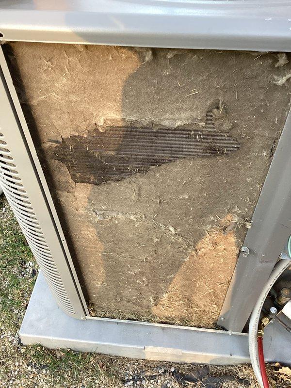Completed comprehensive AC tune-up on 10-year-old system per annual membership agreement. Inspected outdoor condenser unit, noting significant dust and debris accumulation on coil fins and interior components. Performed standard maintenance procedures including coil cleaning, system diagnostics with testing equipment, and verification of refrigerant lines. System operating properly upon completion with all components functioning within normal parameters.