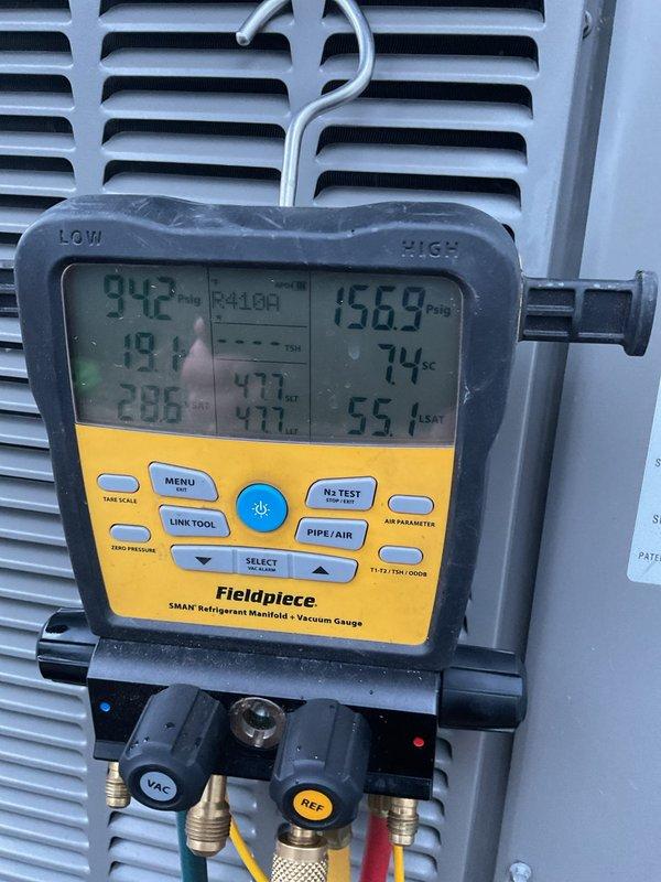 Completed scheduled air conditioning maintenance on outdoor condenser unit. Performed system diagnostics using refrigerant manifold gauge, recording temperature and pressure readings across the system. Replaced air filter and evaporator pad as part of routine maintenance protocol. Unit exhibited significant exterior cabinet deterioration with extensive paint peeling and exposed metal surfaces, though system operational parameters remained within acceptable ranges during testing.