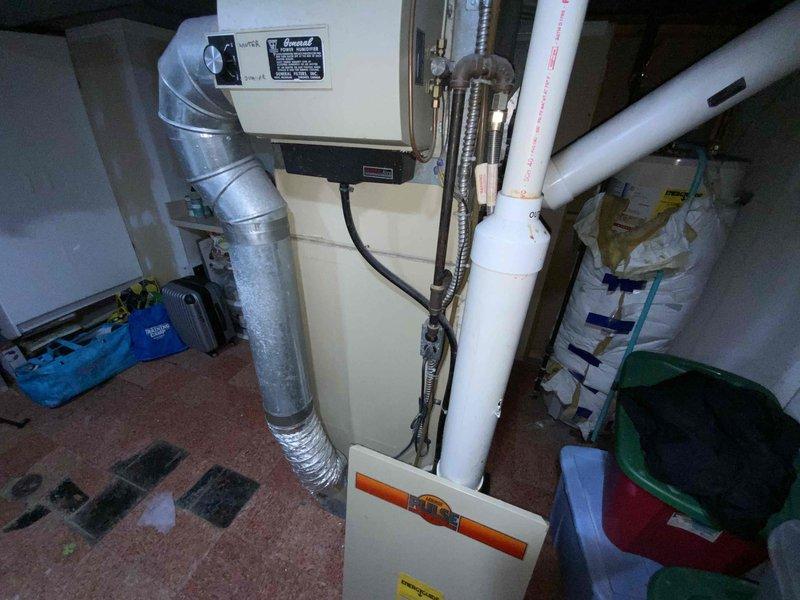 Provided comprehensive estimate for complete HVAC system replacement including furnace and air conditioning unit for 41-year-old equipment currently located in basement. Existing system remains operational but has exceeded typical service life expectancy. Assessment included evaluation of outdoor condensing unit positioned in side yard area and basement-installed furnace with associated ductwork and electrical components.