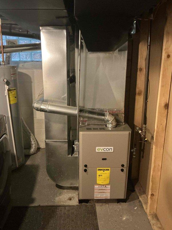 Conducted full system estimate for residential property currently without central air conditioning. Assessed existing Evcon furnace unit in basement mechanical room and evaluated electrical panel capacity for new AC system installation. Documented existing HVAC infrastructure, ductwork configuration, and electrical service to determine equipment requirements and installation scope for complete central air conditioning system addition.