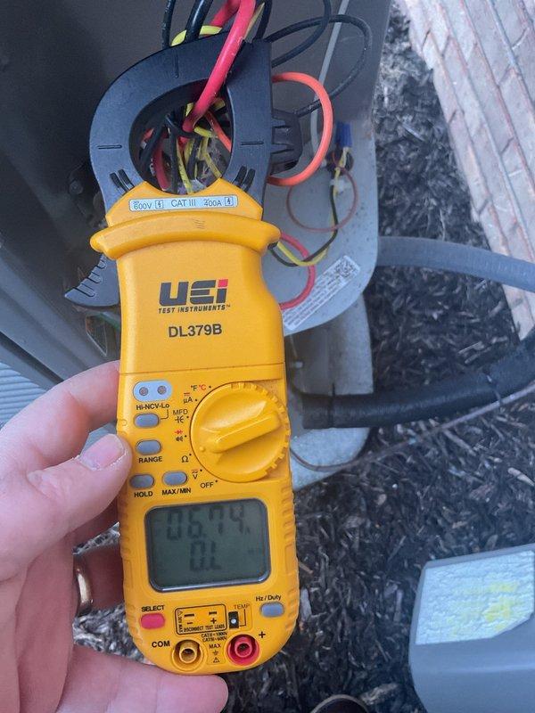 Completed scheduled Air Care Maintenance on residential air conditioning system. Performed electrical diagnostics using digital multimeter to verify proper amperage and voltage readings at contactor and electrical connections. Inspected outdoor condensing unit, removed access panel, and assessed filter condition which showed significant dirt and debris accumulation requiring attention. Documented equipment condition through photos for service records.
