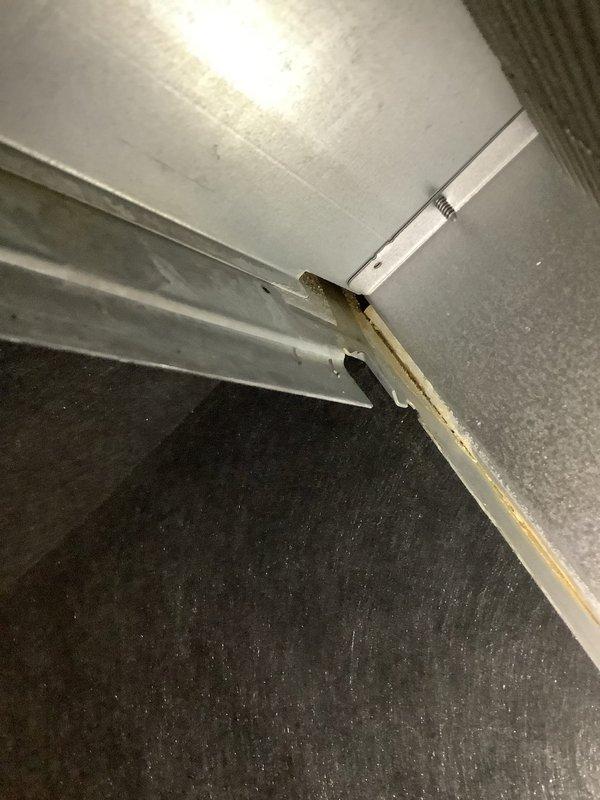 Responded to service call for 4-year-old furnace leaking water under warranty coverage. Upon inspection, identified water staining on ductwork and adjacent piping near floor level, indicating active condensate leak. Traced source to condensate drain system, cleared blockage in drain line, and verified proper drainage flow. Inspected heat exchanger and secondary heat exchanger for cracks or failures, confirmed integrity intact. Tested condensate pump operation and adjusted drain pan positioning to ensure proper water collection and discharge. System restored to normal operation with no further leakage observed during run cycle testing.