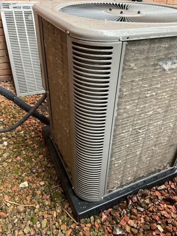 Completed comprehensive 5-year ComfortGuard maintenance visit on residential HVAC system. Performed thorough inspection of indoor furnace unit, accessing internal compartment to examine control board, pressure switches, gas valve assembly, and electrical connections. Replaced air filter and evaporator pad as requested. Inspected outdoor condensing units, noting exterior weathering and debris accumulation around equipment. Verified all safety controls, wiring connections, and refrigerant lines were secure and functioning properly. System operational upon completion.