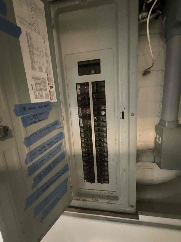 Conducted on-site assessment for new multi-zone mini split installation to provide heating and cooling to 4-6 rooms throughout the residence. Evaluated existing electrical infrastructure, including main panel capacity and available breaker spaces in utility room, to determine compatibility and requirements for new system installation. Documented current electrical configuration and photographed panel layout to develop comprehensive installation plan and ensure proper power supply for multi-head ductless system.