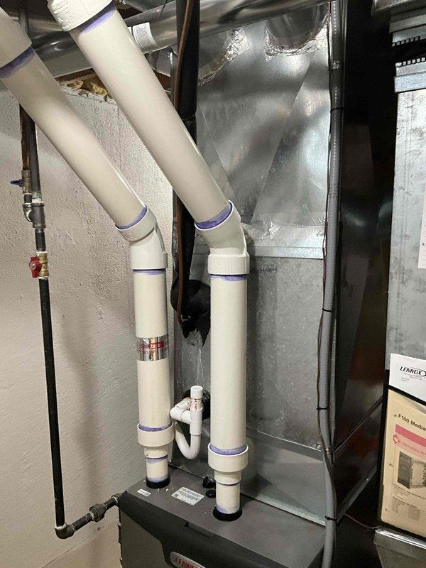 Provided comprehensive HVAC replacement estimate for 28-year-old non-operational air conditioning system and natural gas furnace located in basement. Assessed existing Lennox equipment, ductwork configuration, PVC condensate drainage system, and gas line connections. Documented current installation including metallic plenum, insulated piping, and equipment clearances to develop replacement recommendations.