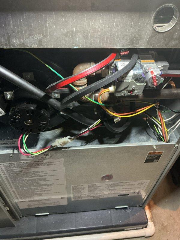 Completed annual furnace tune-up and maintenance inspection under air care membership coverage. Performed comprehensive system evaluation including gas valve operation check, blower motor inspection, electrical connection verification, and burner assembly assessment. All internal components including Honeywell gas valve, wiring harness, and blower assembly found in proper working condition with no immediate service needs identified.