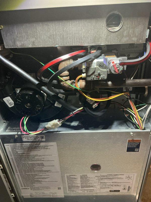 Completed annual furnace tune-up and maintenance inspection under air care membership coverage. Performed comprehensive system evaluation including gas valve operation check, blower motor inspection, electrical connection verification, and burner assembly assessment. All internal components including Honeywell gas valve, wiring harness, and blower assembly found in proper working condition with no immediate service needs identified.