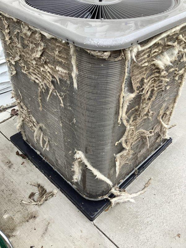 Completed scheduled Air Care Heating and Cooling maintenance on AHC unit 4/1010-2. Upon arrival, discovered severe deterioration of condenser coil insulation with extensive shredding and material separation exposing underlying coil fins. Performed fin straightening and cleaning procedures using fin comb tool to restore proper airflow through heat exchanger coils. Documented pre-existing insulation damage requiring future replacement to prevent continued degradation and maintain unit efficiency.