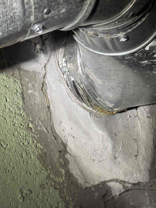 Provided estimate for standard tank-style water heater replacement due to issues with existing unit. Assessed current natural draft water heater installation in basement area, evaluated mechanical space conditions including ductwork clearances and concrete foundation surfaces. Documented exterior utility connections and venting requirements for proper installation planning.