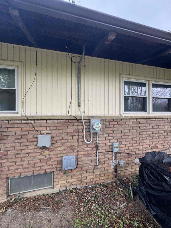 Provided estimate for standard tank-style water heater replacement due to issues with existing unit. Assessed current natural draft water heater installation in basement area, evaluated mechanical space conditions including ductwork clearances and concrete foundation surfaces. Documented exterior utility connections and venting requirements for proper installation planning.