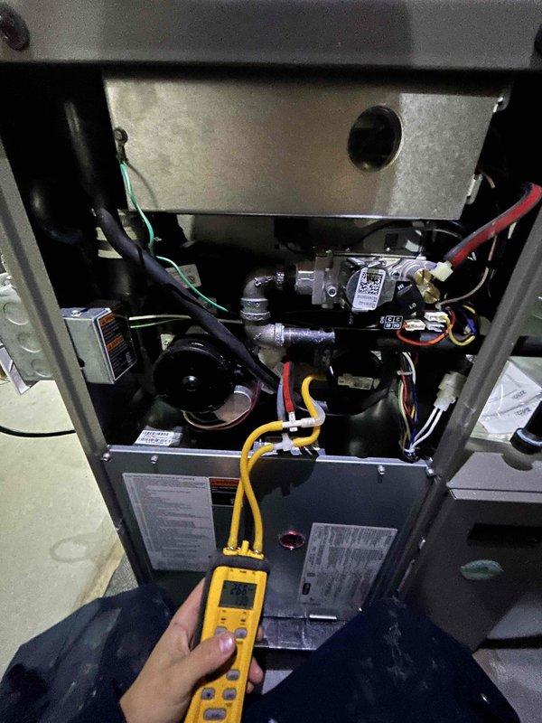 Performed comprehensive annual heating checkup on gas furnace system as part of white glove maintenance service. Conducted electrical diagnostics using digital multimeter to verify proper voltage and amperage at gas valve assembly and control board, and utilized dual-port manometer to measure static pressure readings (26.5 INWC recorded) to ensure optimal airflow and system performance. Inspected burner assembly, heat exchanger, and all electrical connections; provided complimentary air filter replacement and confirmed all components operating within manufacturer specifications.