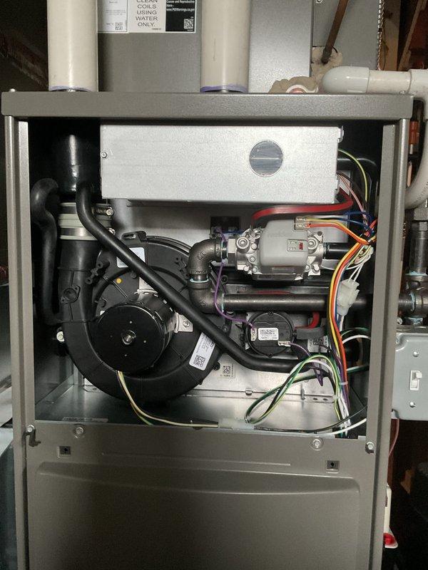Completed comprehensive Air Care Heating and Cooling maintenance inspection on residential HVAC system. Performed thorough examination of furnace components including blower motor assembly, draft inducer, gas valve, heat exchanger with combustion chamber, and control board with all electrical connections verified secure and functioning properly. All internal components found clean and operating within normal parameters, with wiring harnesses properly organized and no issues identified requiring immediate attention.
