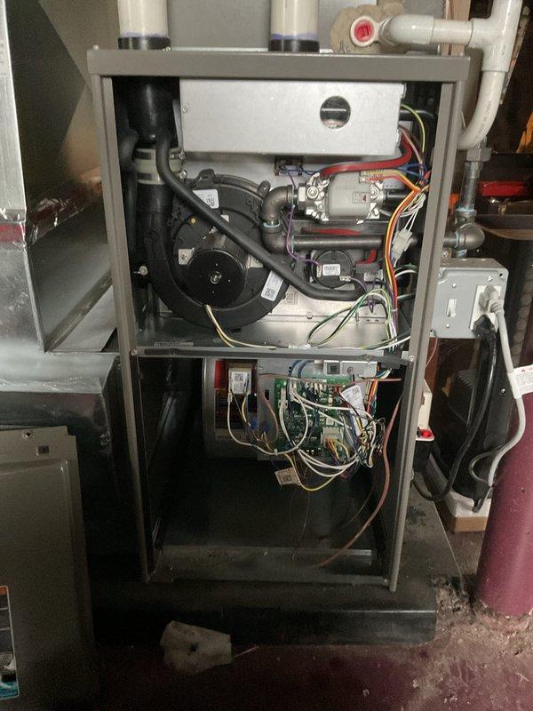 Completed comprehensive Air Care Heating and Cooling maintenance inspection on residential HVAC system. Performed thorough examination of furnace components including blower motor assembly, draft inducer, gas valve, heat exchanger with combustion chamber, and control board with all electrical connections verified secure and functioning properly. All internal components found clean and operating within normal parameters, with wiring harnesses properly organized and no issues identified requiring immediate attention.