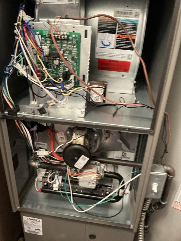 Completed routine HVAC maintenance on Lennox split system including interior furnace unit and outdoor condenser. Inspected control board, blower motor assembly, electrical connections, and all internal components with access panel removed; verified proper operation of heating and cooling systems. Cleaned outdoor condenser coils and verified adequate airflow through louvered panels; all components operating within normal parameters with no repairs needed at this time.