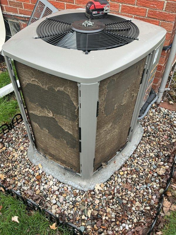 Completed comprehensive Air Care Heating and Cooling maintenance service on residential HVAC system. Inspected and serviced gas furnace, verifying proper operation of blower motor, gas valve assembly, electrical connections, and safety controls including emergency shutoff and leak detection system. Performed outdoor condensing unit inspection and noted heavy dirt and debris accumulation on mesh panels requiring cleaning to maintain optimal airflow and system efficiency.