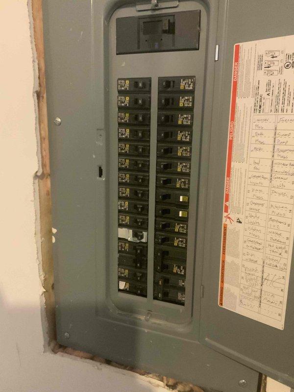 Conducted on-site evaluation for new whole home Kohler generator installation at manufactured home residence. Assessed existing electrical panel configuration, documented current circuit breaker layout and distribution system to determine compatibility and capacity requirements for generator integration. Evaluated panel condition, circuit directory organization, and available space for necessary electrical connections and transfer switch installation required for backup power system.