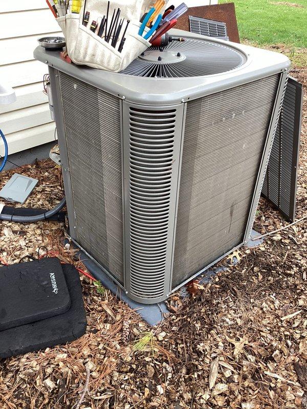 Completed ACM4/102-5 maintenance on residential R410A air conditioning system. Performed system diagnostics using digital manifold gauge set, recording operating pressures of 106.9 psi on low side and 234.9 psi on high side. Measured superheat at 14.1°F and subcooling at 14.3°F, confirming proper refrigerant charge and system operation. Evaporator temperature recorded at 34.8°F with suction line temperature at 48.9°F. Condenser outlet temperature measured at 79.6°F with liquid line temperature at 65.3°F. All readings indicate system is operating within manufacturer specifications with proper refrigerant flow and heat transfer efficiency.