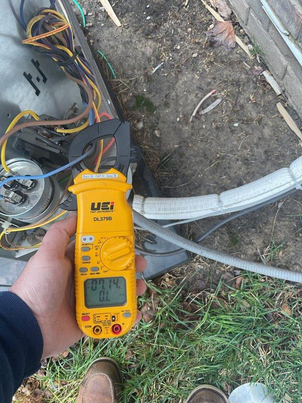 Completed annual cooling maintenance on residential heat pump system. Performed electrical diagnostics with multimeter, recording voltage and amperage readings to verify proper system operation. Coil showed significant debris accumulation including leaves and dirt buildup on aluminum fins; cleaned condenser coil to restore optimal airflow and heat transfer efficiency. Verified all electrical connections, tested system performance parameters, and ensured unit operating within manufacturer specifications.