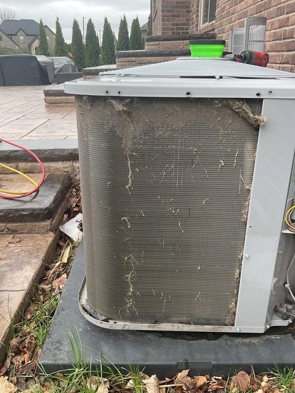 Completed annual cooling maintenance on residential heat pump system. Performed electrical diagnostics with multimeter, recording voltage and amperage readings to verify proper system operation. Coil showed significant debris accumulation including leaves and dirt buildup on aluminum fins; cleaned condenser coil to restore optimal airflow and heat transfer efficiency. Verified all electrical connections, tested system performance parameters, and ensured unit operating within manufacturer specifications.