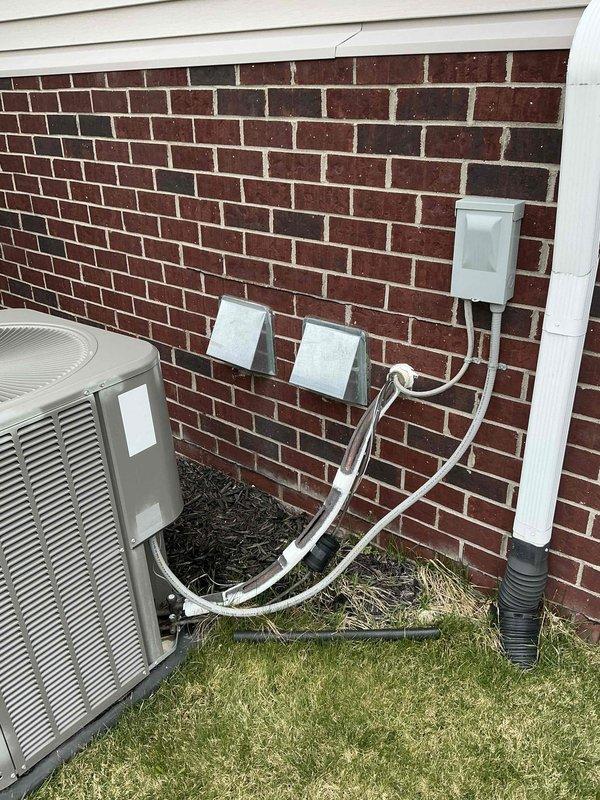 Completed full system estimate for residential HVAC replacement. Inspected existing 10-year-old air conditioning system including indoor furnace unit with visible cabinet damage and exposed insulation, and outdoor condenser unit with refrigerant line sets, electrical disconnect, and condensate drain. Documented current system configuration, photographed equipment condition, and provided comprehensive replacement options for customer requiring immediate system replacement.
