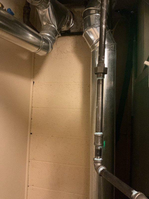 Successfully completed installation of a 3.5-ton air conditioning system with evaporator coil in rear configuration. Installed new copper refrigerant line set with proper insulation, mounted condensate pump with electronic controls featuring indicator lights, and connected all necessary ductwork and drainage components. Reconnected electrical service, verified proper system operation, and ensured all mechanical and refrigeration connections met code requirements as permits were previously requested.